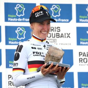 Franziska Koch of Germany and Team FDJ United - SUEZ celebrates at podium as race winner with the cobblestone-race-trophy
