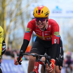 Kamilla Aasebo crosses the finish line during the 2026 Omloop Het Nieuwsblad