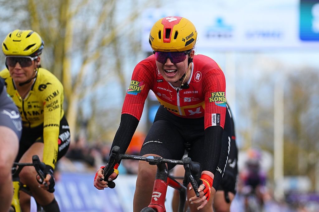 Kamilla Aasebo crosses the finish line during the 2026 Omloop Het Nieuwsblad