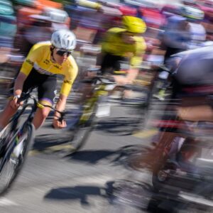 Riders of the men's WorldTour peloton race uphill during stage 2 of the 2026 Tour de Romandie