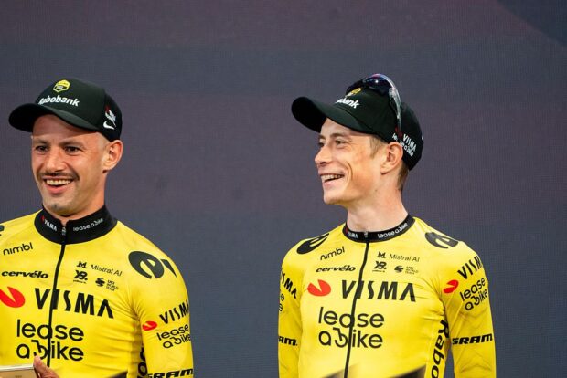 Victor Campenaerts literally Jonas Vingegaard's right-hand man as the two stand on the stage during the Giro d'Italia presentation
