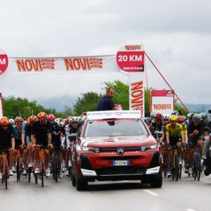 Italy's race director and former cyclist Marco Velo talks with rides after a crash during the 2nd stage of the Giro d'Italia 2026 - Tour of Italy cycling race between Burgas and Veliko Tarnovo, Bulgaria, on May 9, 2026. (Photo by Luca Bettini / AFP)