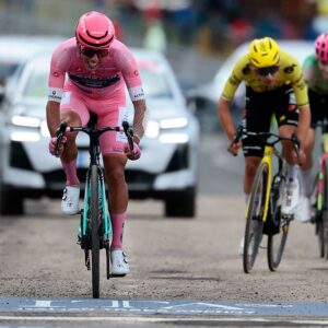 Bahrain - Victorious Portuguese rider Afonso Eulalio wearing the overall leader's pink jersey (Maglia Rosa) rides to cross the finish line of the 7th stage of the Giro d'Italia 2026