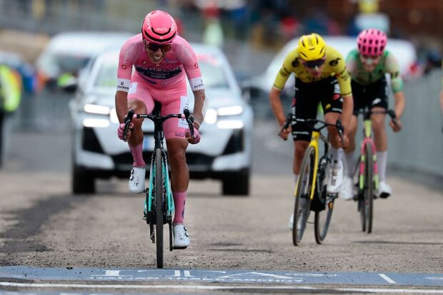 Bahrain - Victorious Portuguese rider Afonso Eulalio wearing the overall leader's pink jersey (Maglia Rosa) rides to cross the finish line of the 7th stage of the Giro d'Italia 2026