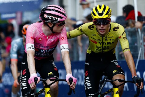 Team Visma Lease a Bike Danish rider Jonas Vingegaard and teammate Italian rider Davide Piganzoli cross the finish line of the 18th stage of the Giro d'Italia 2026 - Tour of Italy cycling race between Fai della Paganella and Pieve di Soligo, Italy, on May 28, 2026. (Photo by Luca Bettini / AFP)