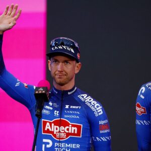 Kaden Groves waves at the crowd during the Giro d'Italia 2026 team presentation