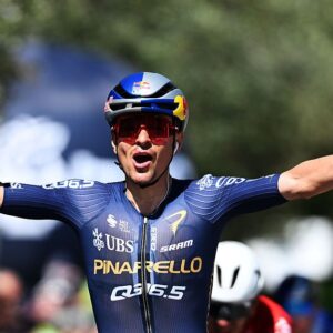 Tom Pidcock celebrates at the finish line as stage winner during the 48th Tour of the Alps 2026, Stage 3