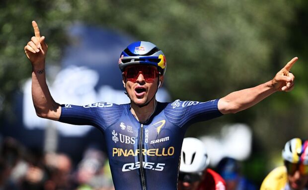 Tom Pidcock celebrates at the finish line as stage winner during the 48th Tour of the Alps 2026, Stage 3