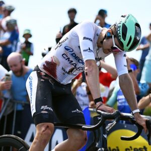 GRAND COLOMBIER, FRANCE - JUNE 13: (EDITOR’S NOTE: Image contains graphic content.) Paul Seixas of France and Team Decathlon CMA CGM - White Best Young Rider Jersey crosses the finish line injured after being involved in a crash during the 78th Tour Auvergne-Rhone-Alpes 2026, Stage 7 a 133.6km stage from La Bridoire to Grand Colombier 1496m / #UCIWT / on June 13, 2026 in Grand Colombier, France. (Photo by Dario Belingheri/Getty Images)