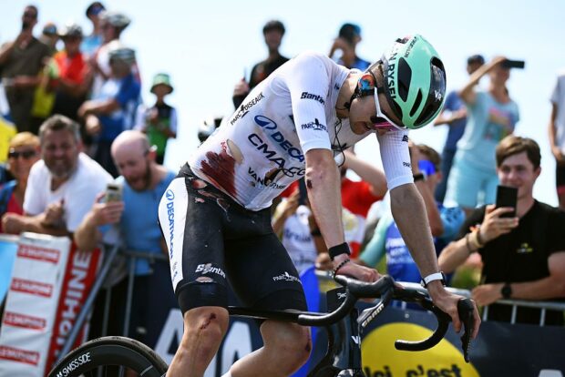 GRAND COLOMBIER, FRANCE - JUNE 13: (EDITOR’S NOTE: Image contains graphic content.) Paul Seixas of France and Team Decathlon CMA CGM - White Best Young Rider Jersey crosses the finish line injured after being involved in a crash during the 78th Tour Auvergne-Rhone-Alpes 2026, Stage 7 a 133.6km stage from La Bridoire to Grand Colombier 1496m / #UCIWT / on June 13, 2026 in Grand Colombier, France. (Photo by Dario Belingheri/Getty Images)