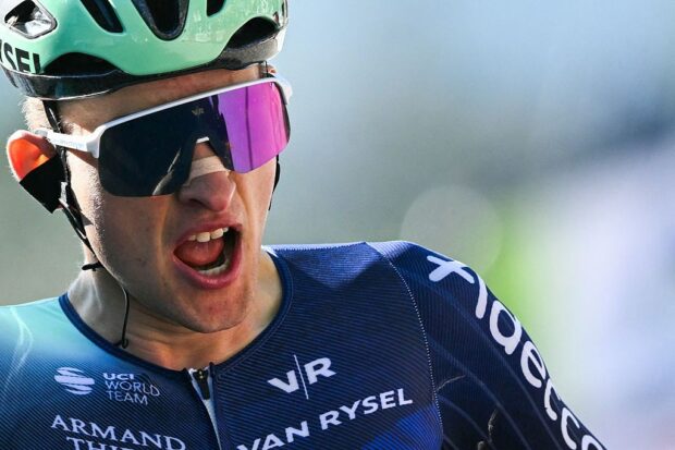 Paul Seixas celebrates as he crosses the finish line to win La Fleche Wallonne