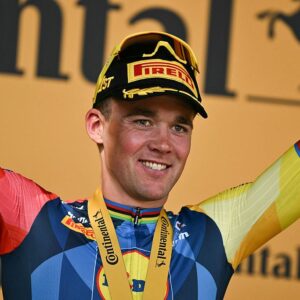 Lidl - Trek team's Danish rider Mads Pedersen celebrates on the podium after winning the 4th stage of the Tour de France