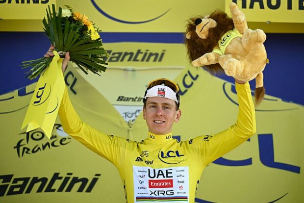 UAE Team Emirates - XRG's Slovenian rider Tadej Pogacar celebrates on the podium with the overall leader's yellow jersey after the 16th stage of the 113th edition of the Tour de France cycling race, 26 km between Évian-les-Bains and Thonon-les-Bains in the French Alps, on July 21, 2026. (Photo by Loic VENANCE / AFP)