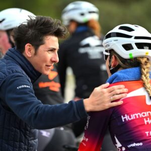 Giorgia Bronzini speaking with a rider while working with Human Powered Health
